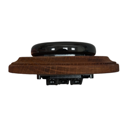 Black porcelain UK Plug Socket with dark wood frame, flush-mounted, angled