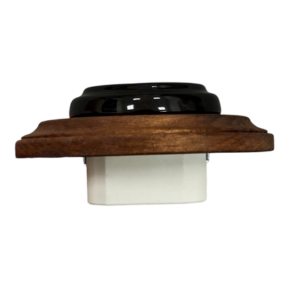 Single Type F porcelain socket with wood frame, black, flush-mounted, angled