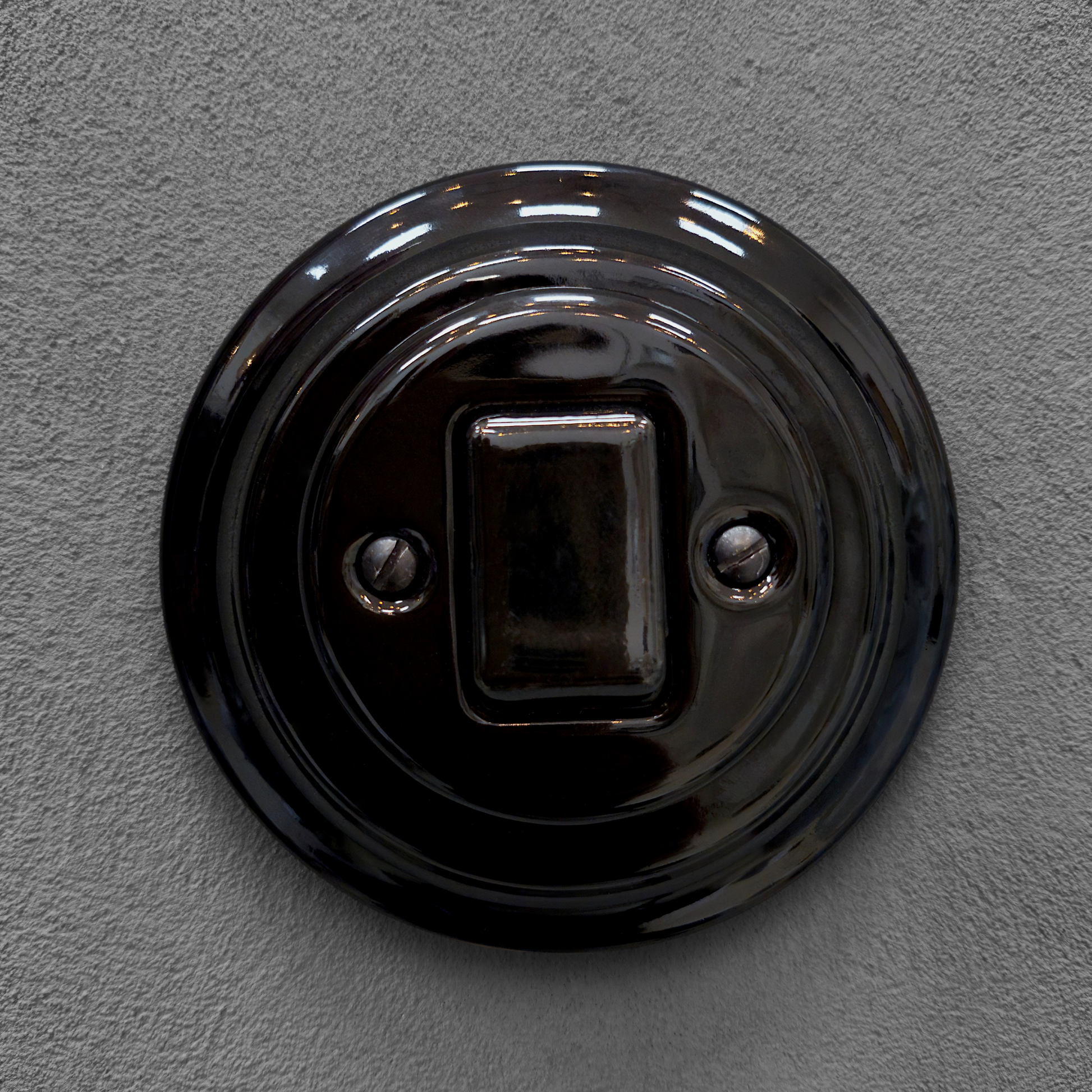 black porcelain intermediate big key light switch, flush-mount, front