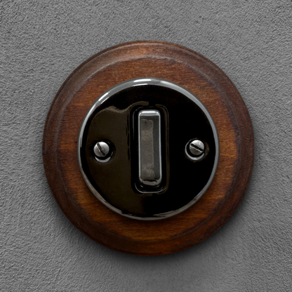 black porcelain 1gang2way light switch dark wood frame, flush-mount, front