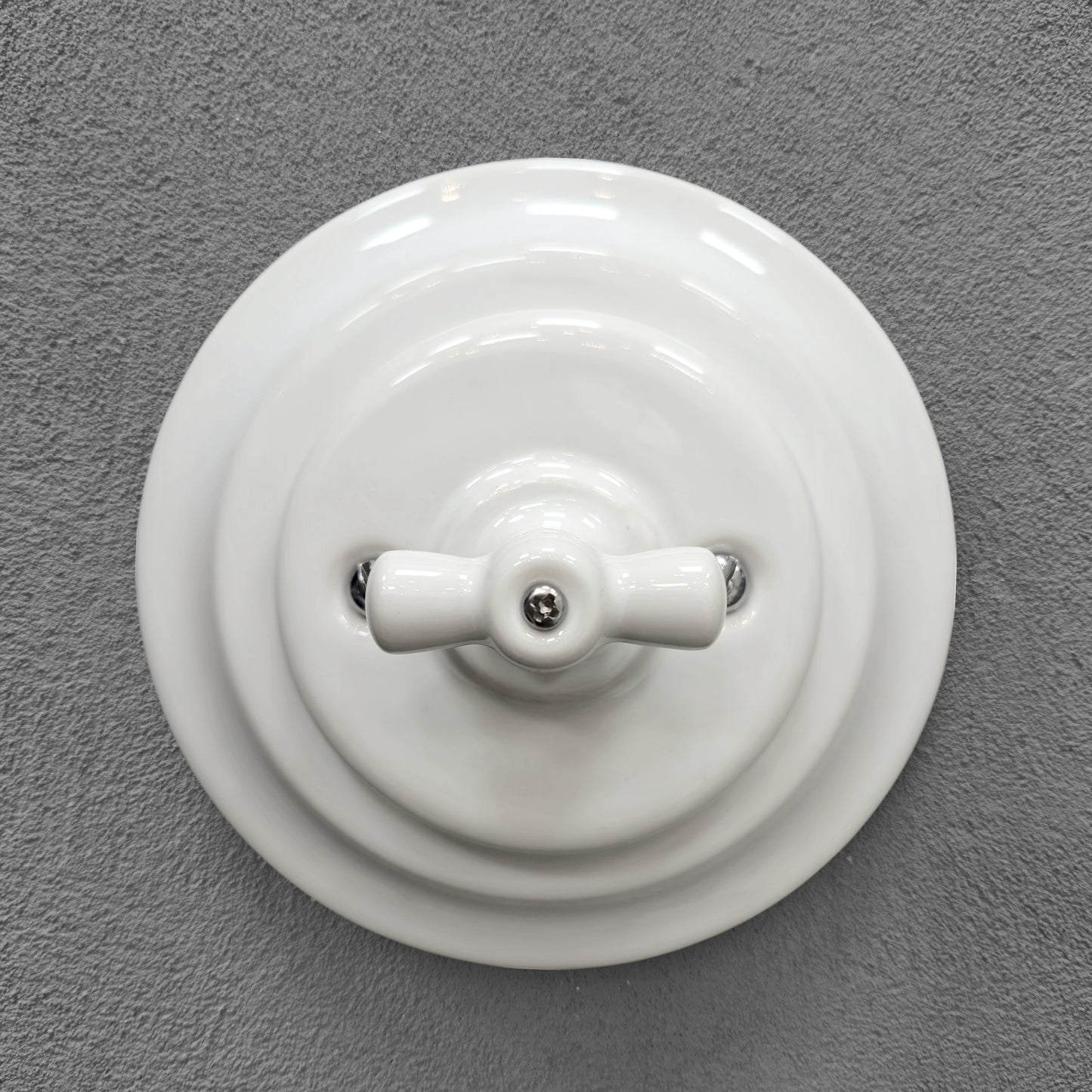 white porcelain rotary intermediate light switch, flush-mount, front