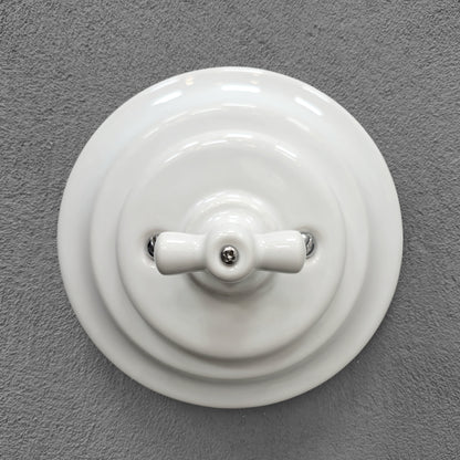 white porcelain 1gang2way rotary switch, flush-mount, front