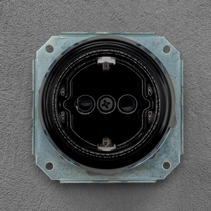 vintage black porcelain Schuko power socket insert flush-mounted