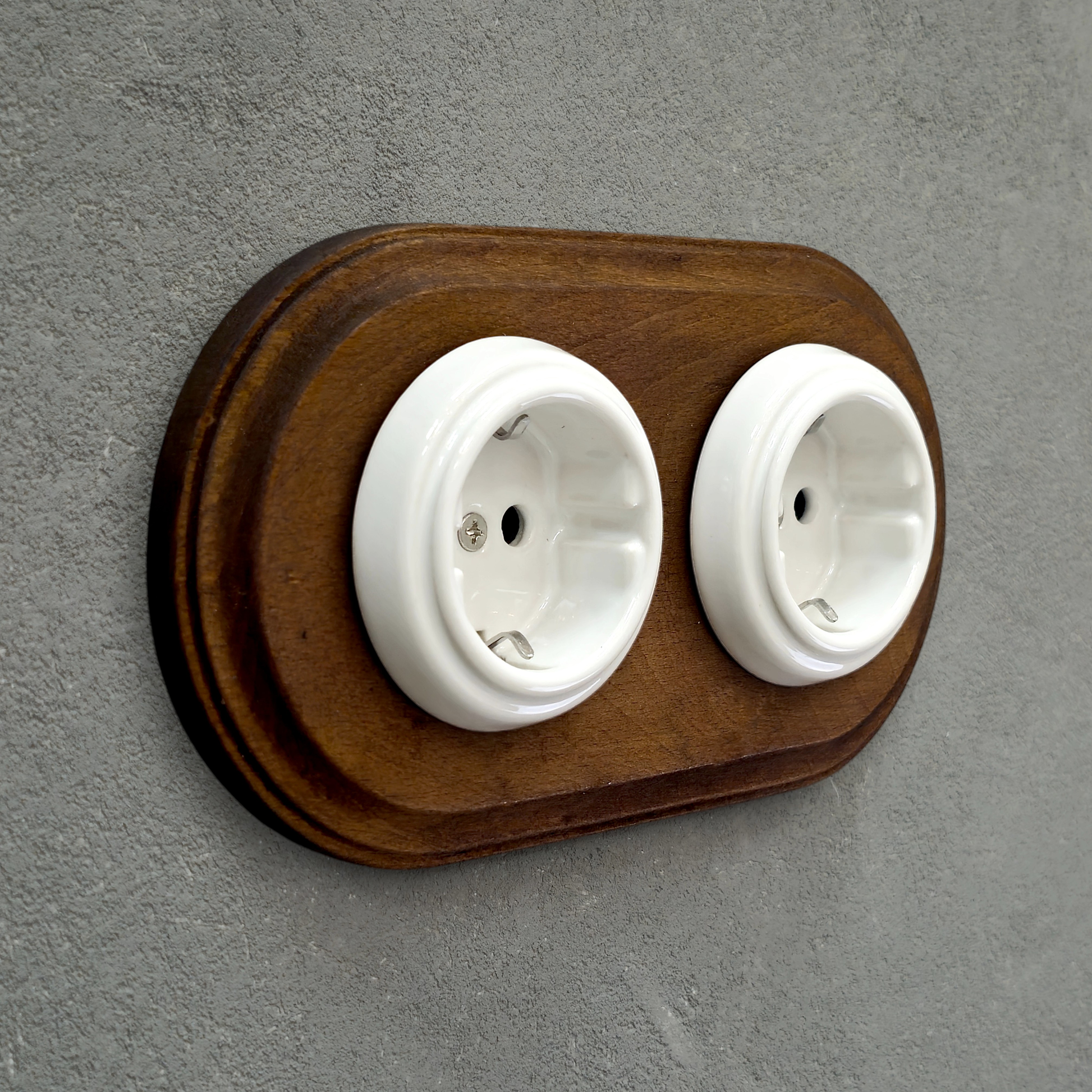 Double SCHUKO porcelain socket with dark wooden frame, white, flush-mounted, side view