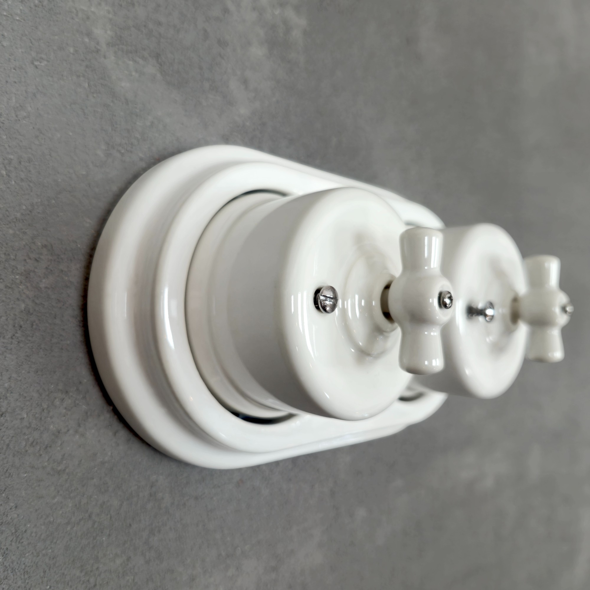 double white porcelain intermediate rotary light switch, surface-mount, angled