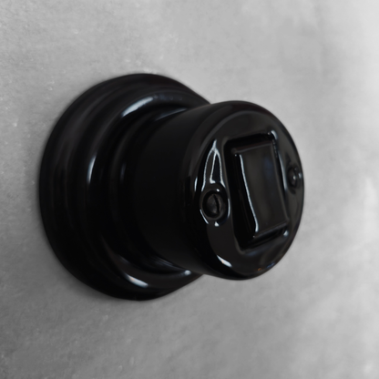 black porcelain intermediate big key light switch, surface-mount, angled