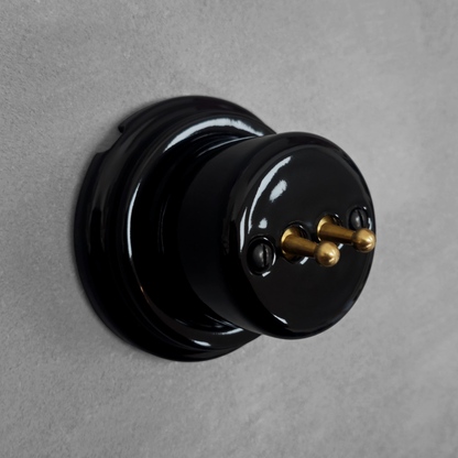 black porcelain 2gang2way toggle light switch, surface-mount, angled