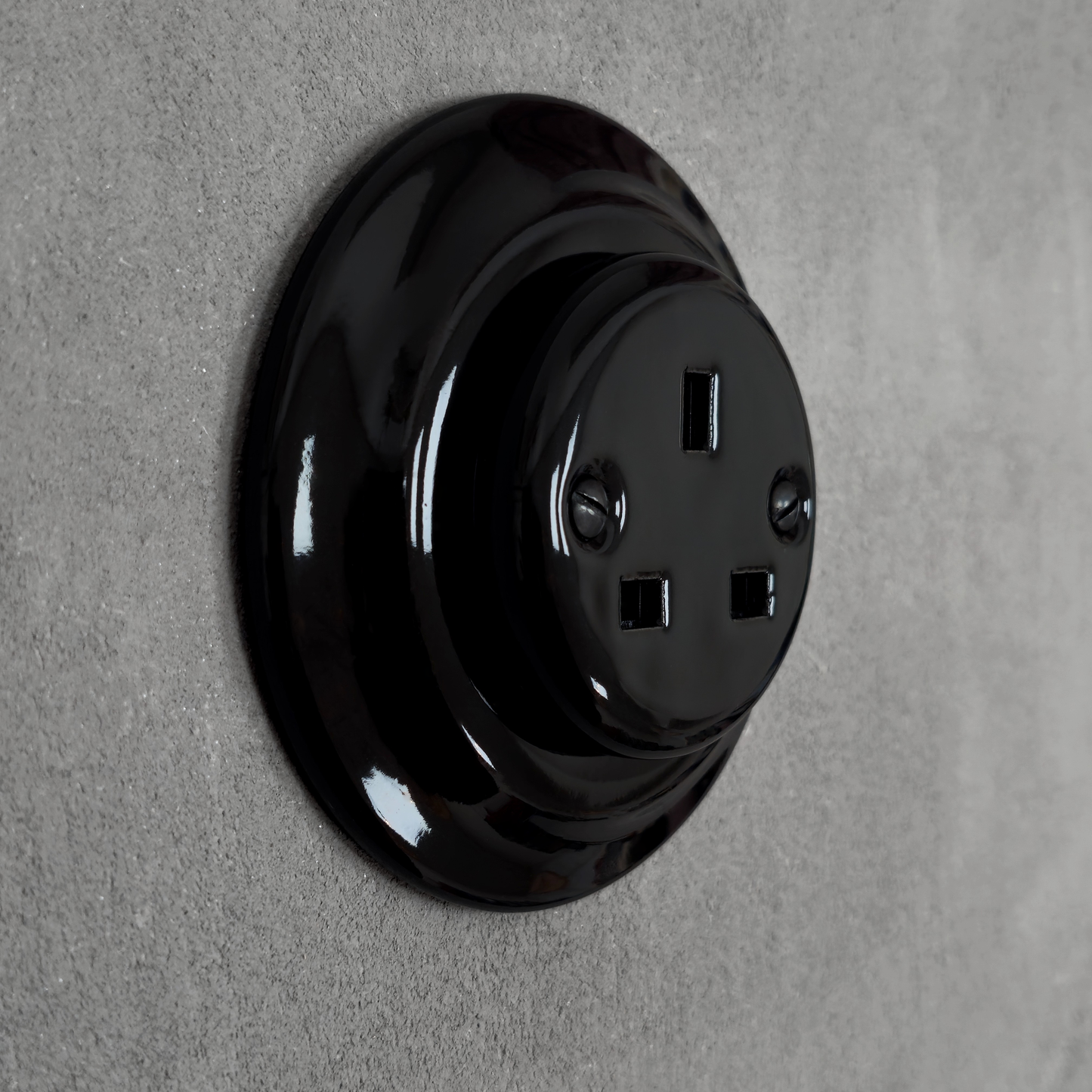 Black porcelain UK Plug Socket, flush-mounted, side