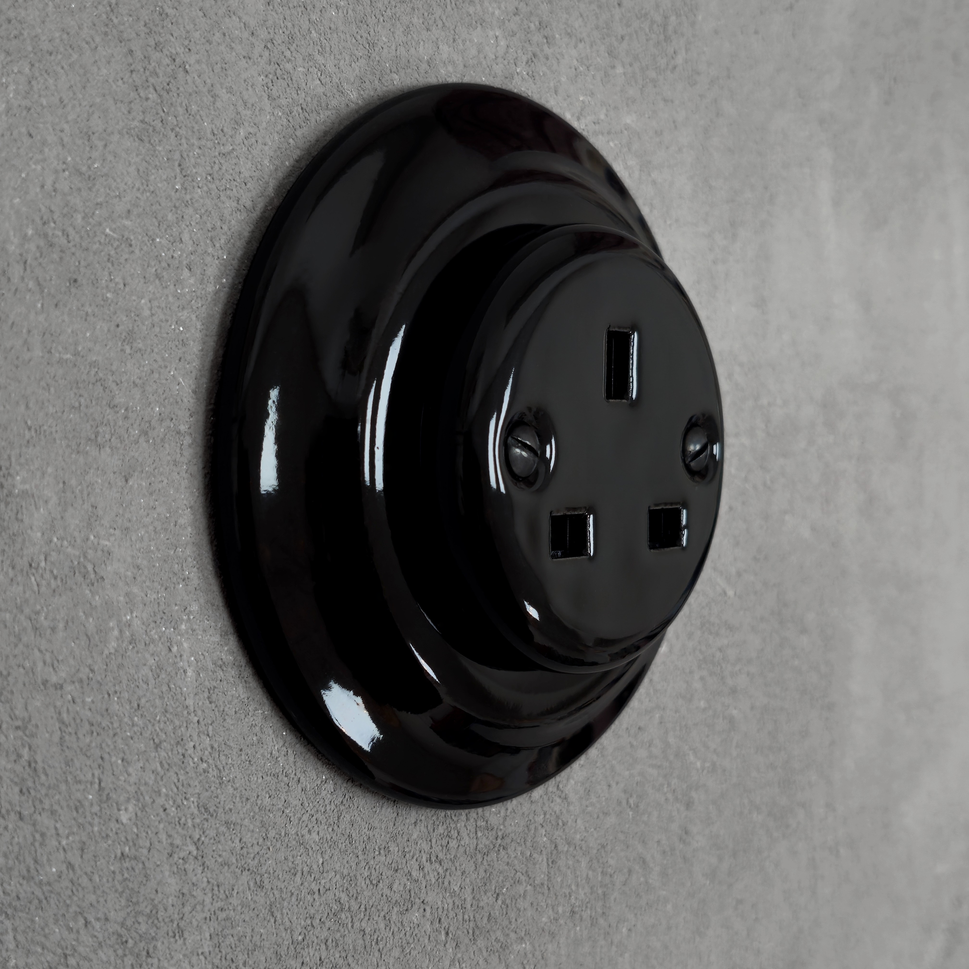Black porcelain UK Plug Socket, flush-mounted, side