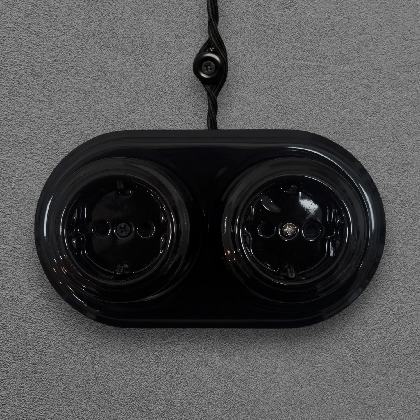 vintage double black porcelain Schuko power socket surface-mounted