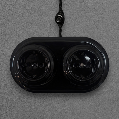 vintage double black porcelain Schuko power socket surface-mounted