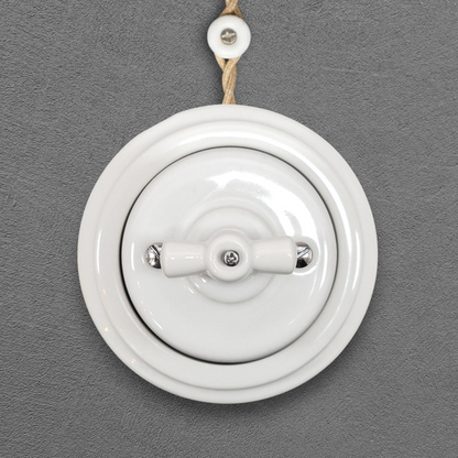 white porcelain 1gang2way rotary light switch, surface-mount, front