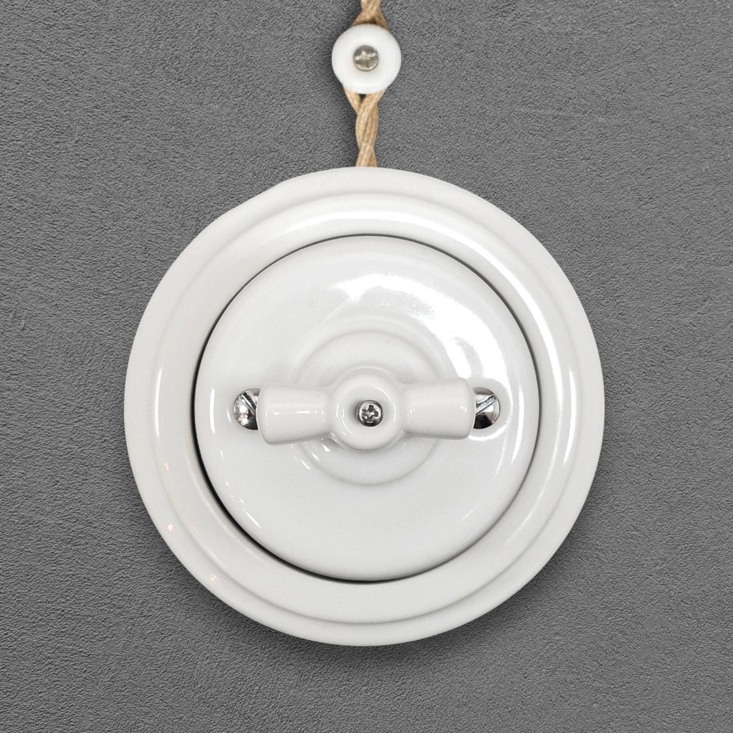 white porcelain double1way rotary light switch, surface-mount, front