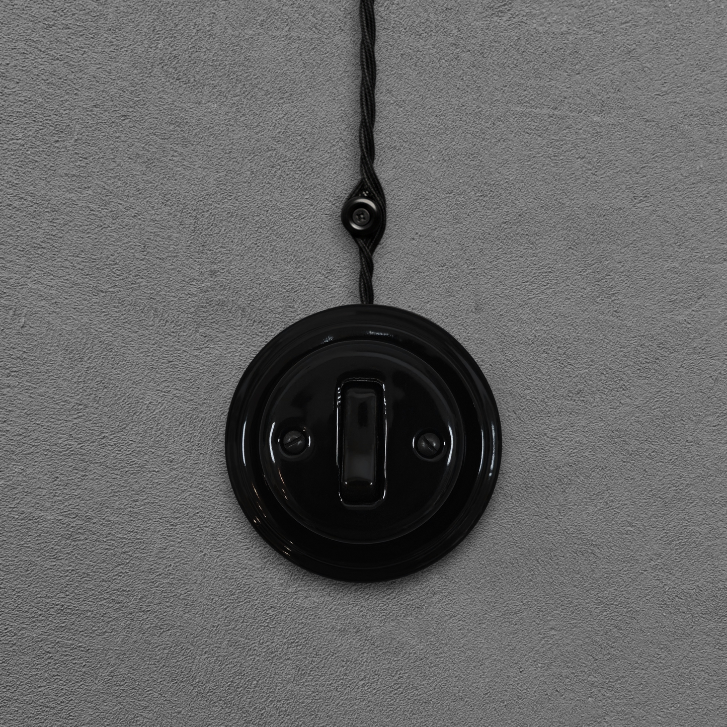 black porcelain 1gang2way light switch, surface-mount