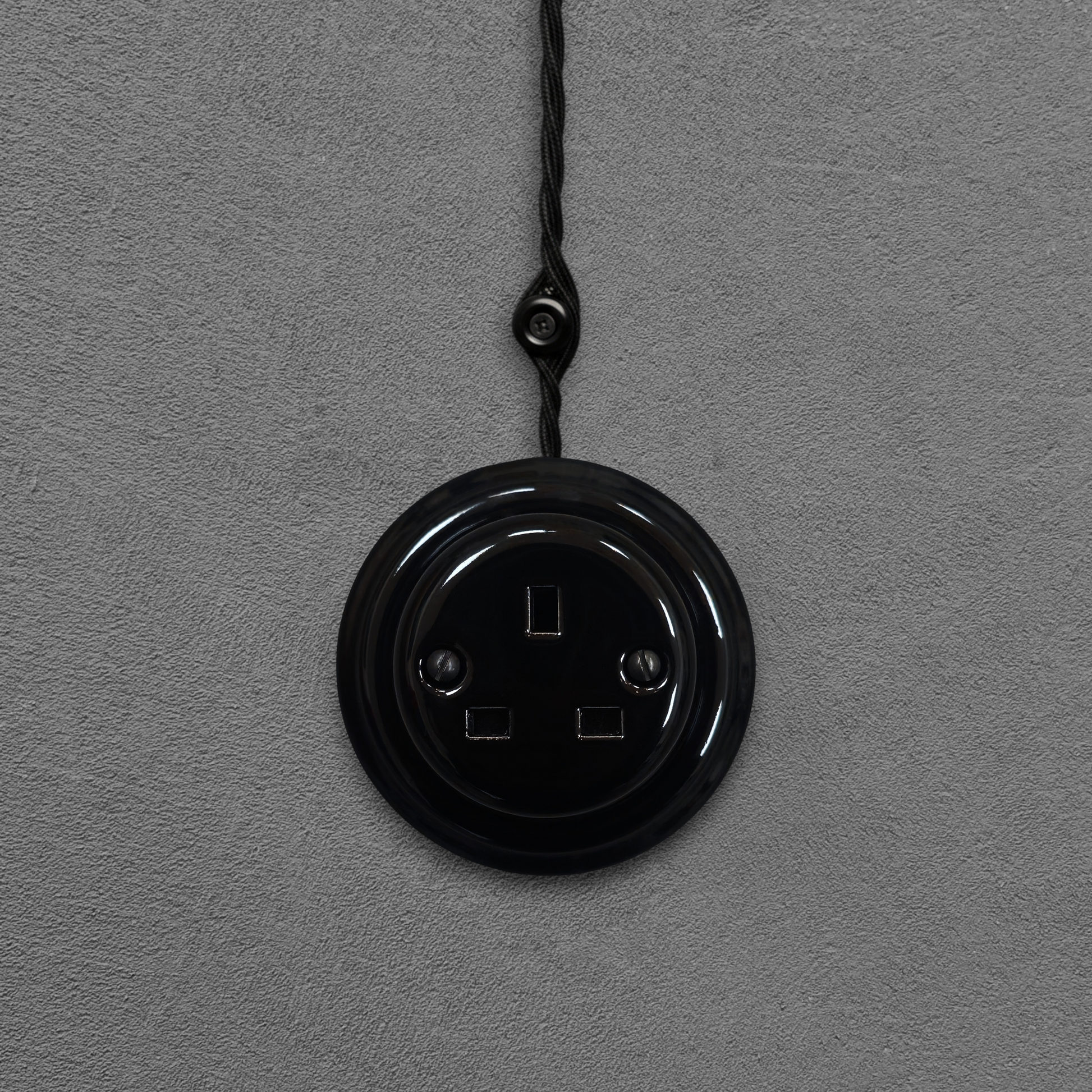 Black porcelain UK Plug Socket, surface-mounted