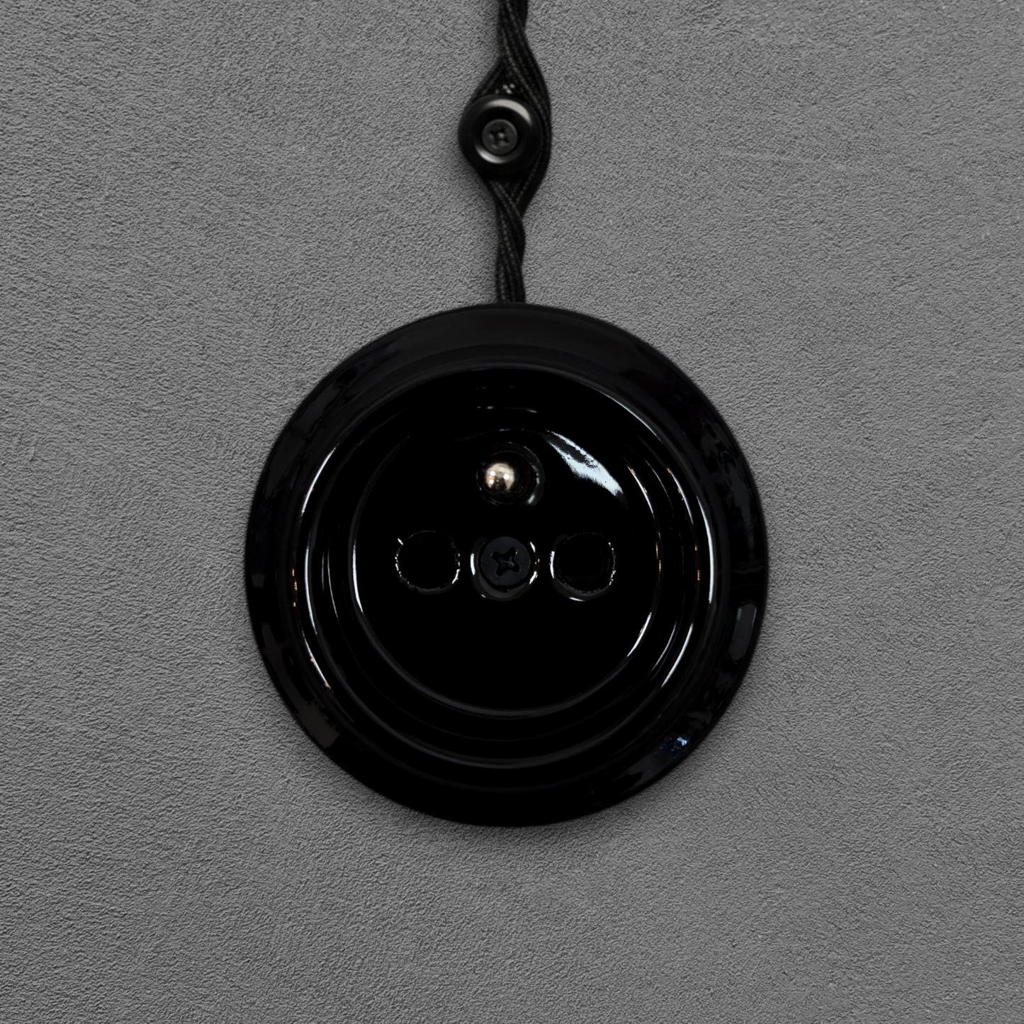 Single black French porcelain socket insert, surface-mount, front