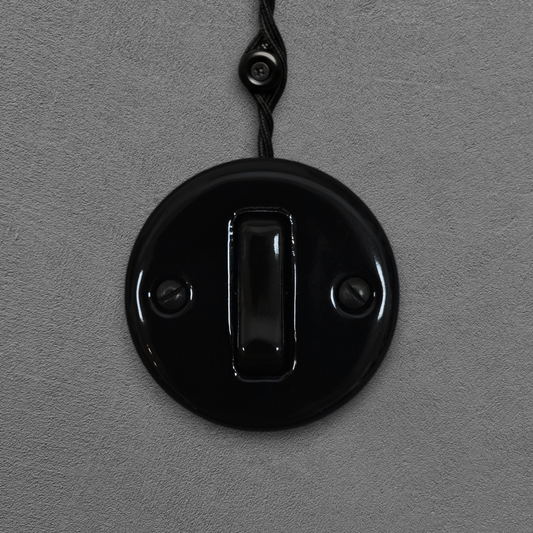 black porcelain 1gang2way light switch insert, surface-mount, front