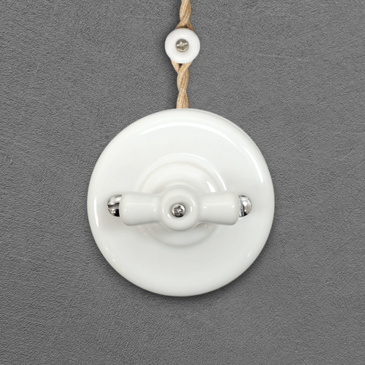 white porcelain 1gang2way rotary switch insert, surface-mount, front