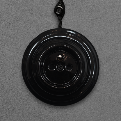 Single black French porcelain socket, surface-mount, front
