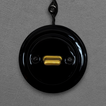 black porcelain intermediate toggle switch, surface-mount, front