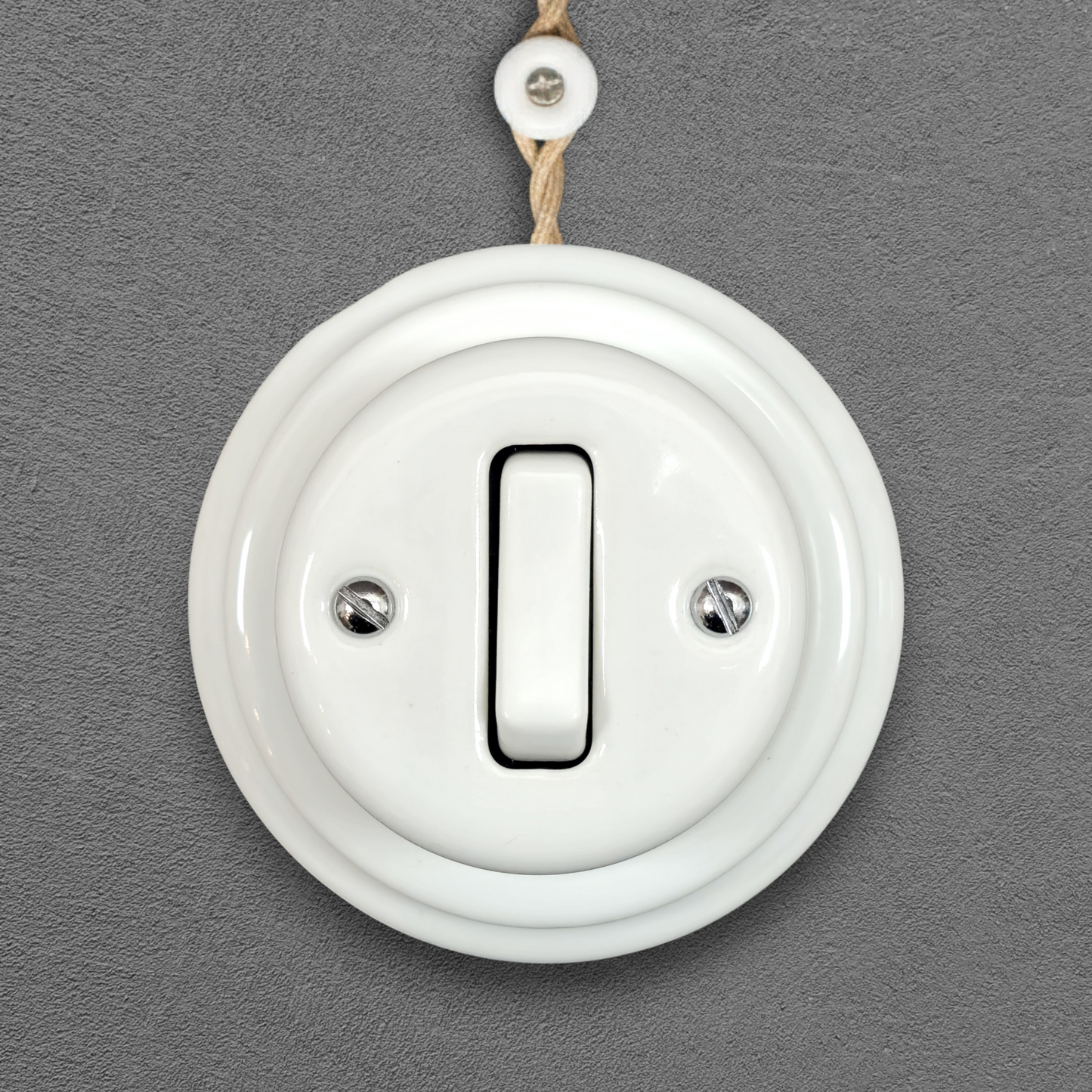 white porcelain 1gang2way light switch, surface-mount, front
