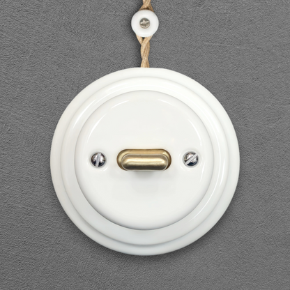 white porcelain intermediate toggle switch, surface-mount, front