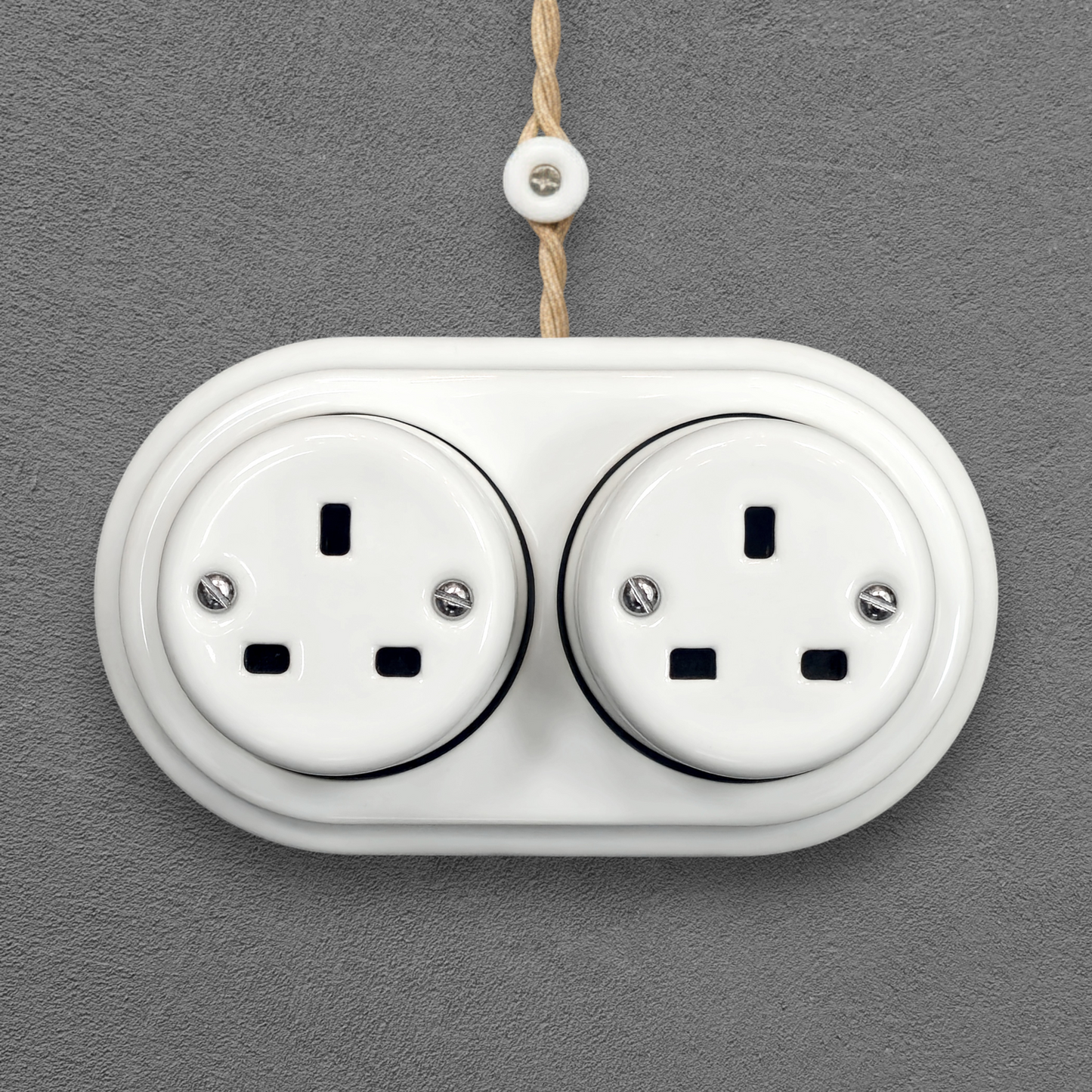 Double white porcelain UK Plug Socket, surface-mounted, front