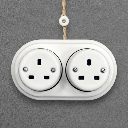 Double white porcelain UK Plug Socket, surface-mounted, front