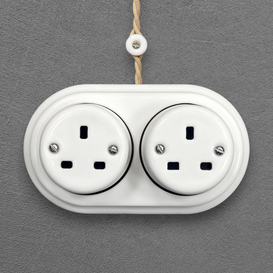 Double white porcelain UK Plug Socket, surface-mounted, front