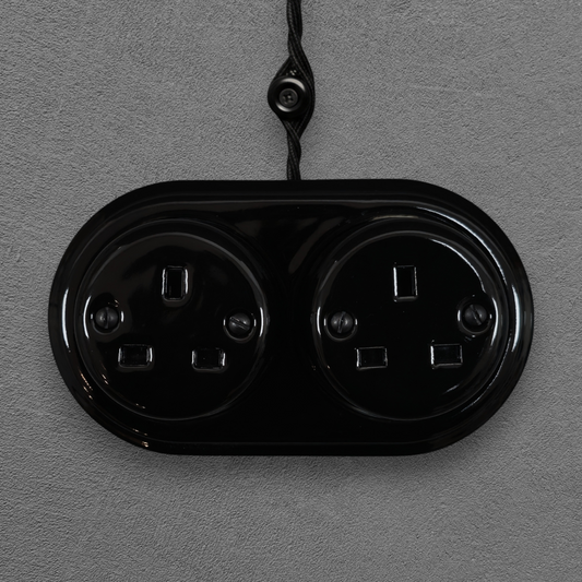 Double black porcelain UK Plug Socket, surface-mounted, front