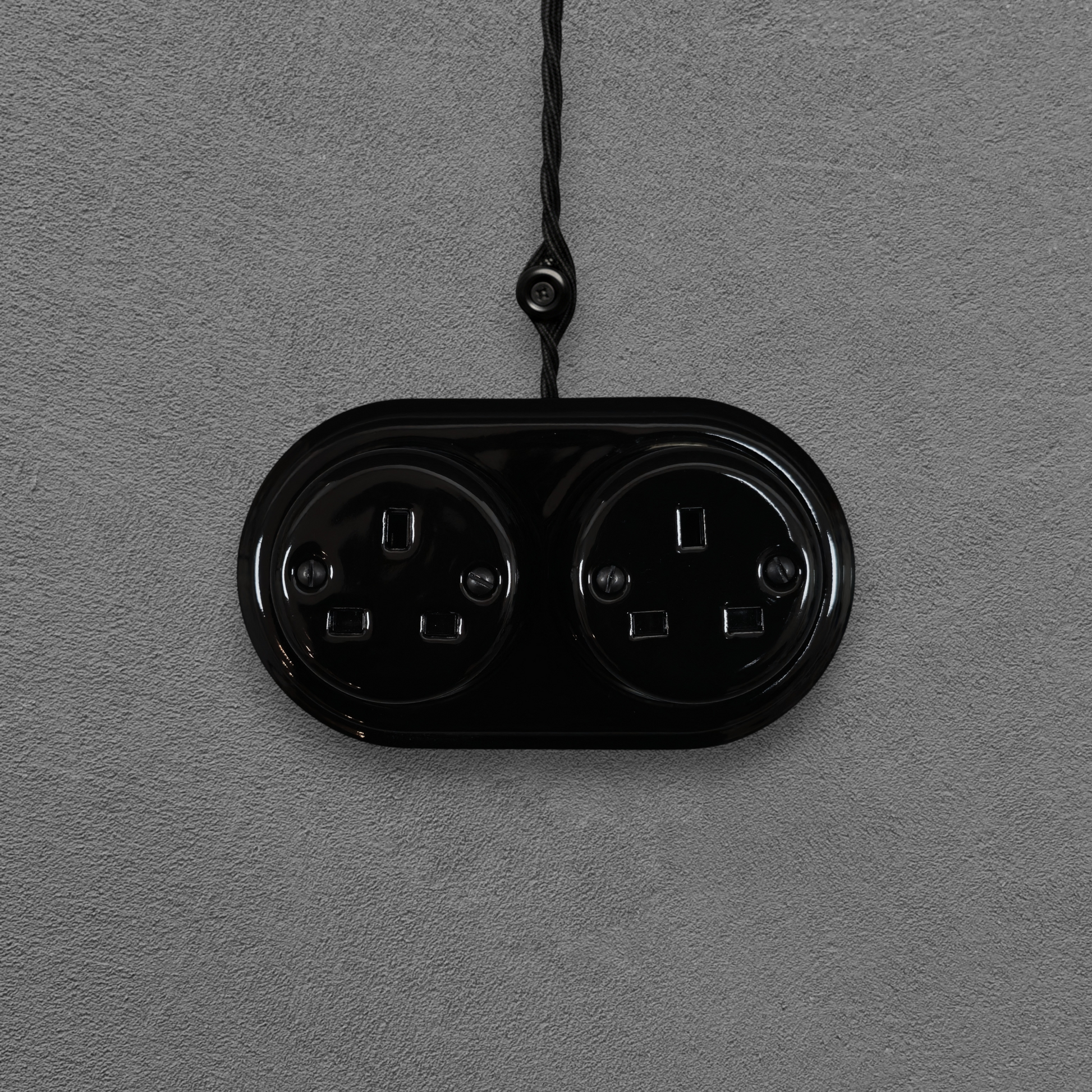 Double black porcelain UK Plug Socket, surface-mounted