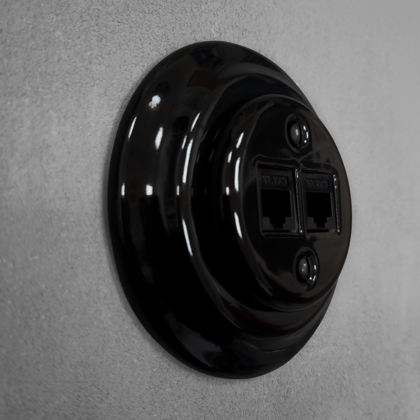 Black porcelain RJ45 Ethernet socket, flush-mounted, side