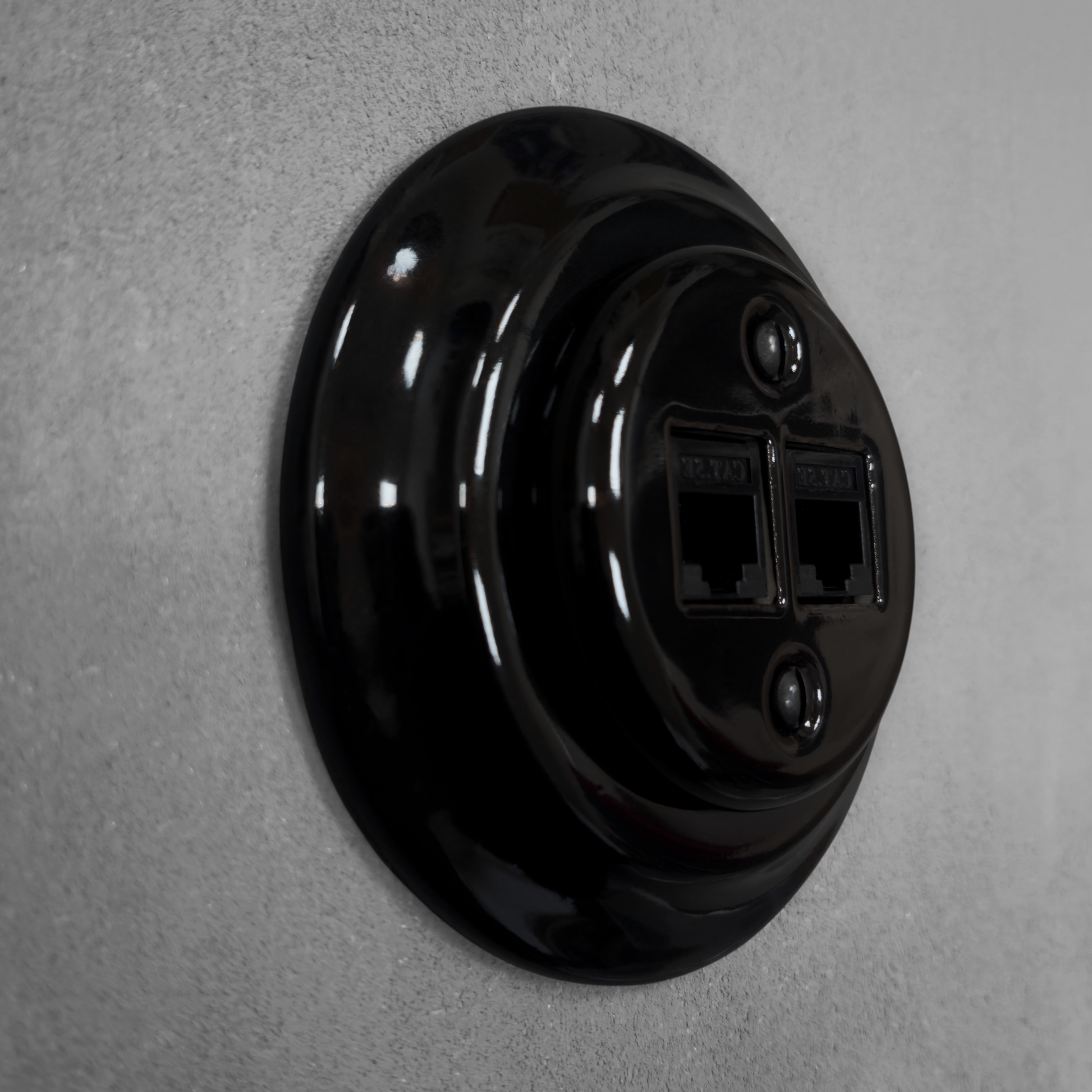 Black porcelain RJ45 Ethernet socket, flush-mounted, side