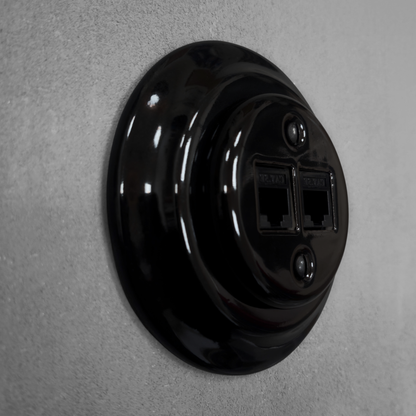 Black porcelain RJ45 Ethernet socket, flush-mounted, side