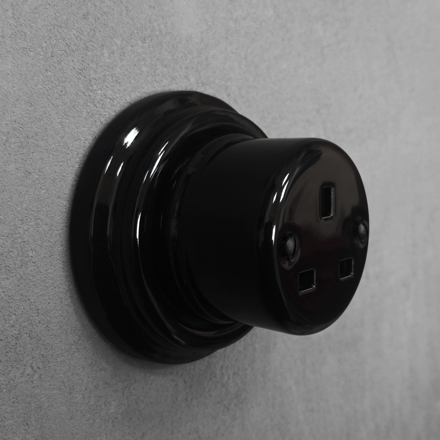 Black porcelain UK Plug Socket, surface-mounted, side