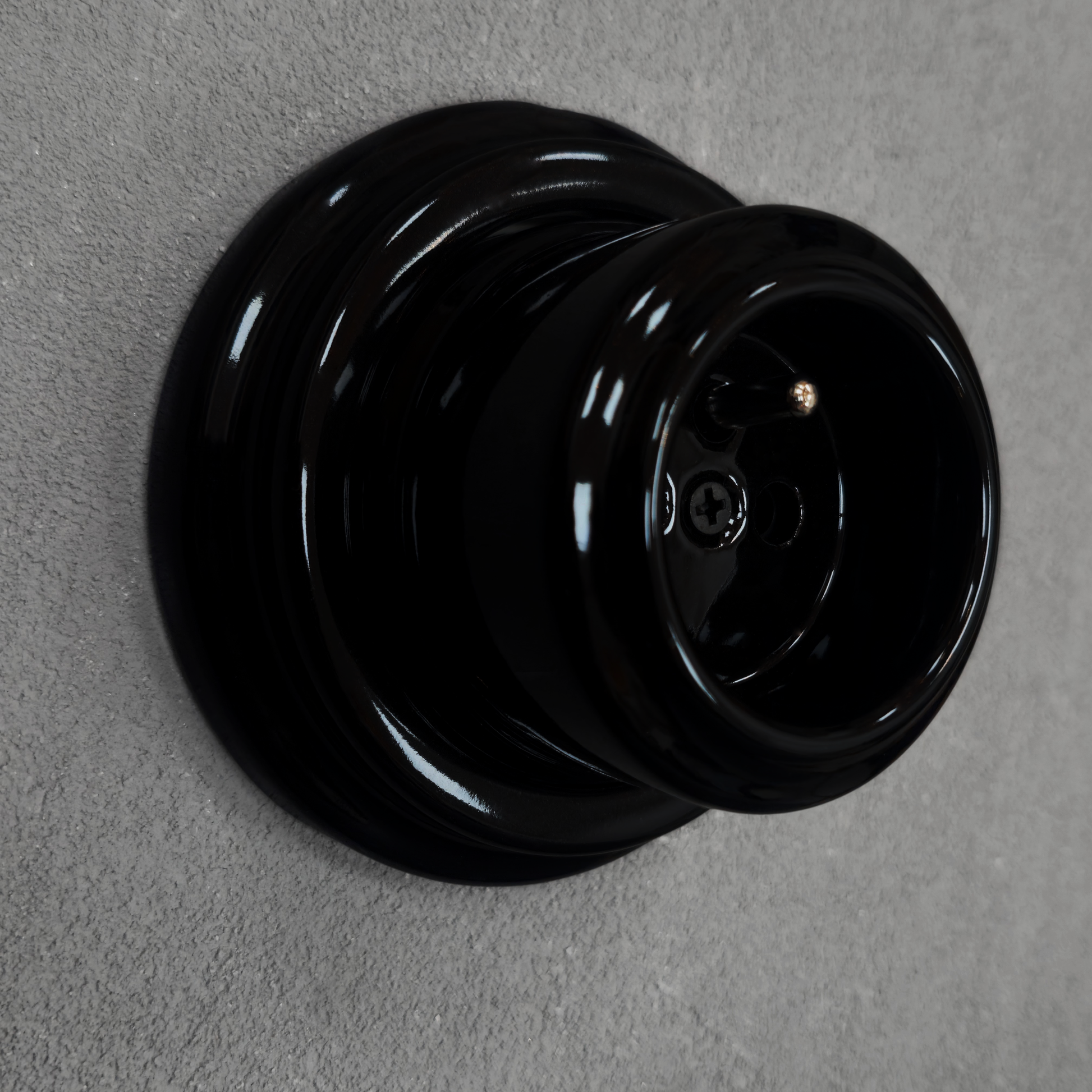 Single black French porcelain socket, surface-mount, side