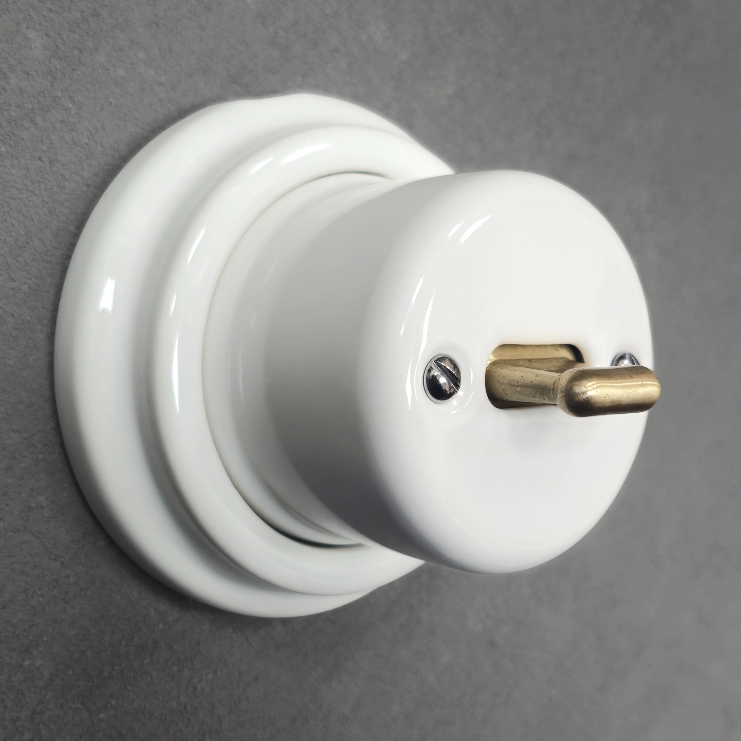white porcelain intermediate toggle switch, surface-mount, angled