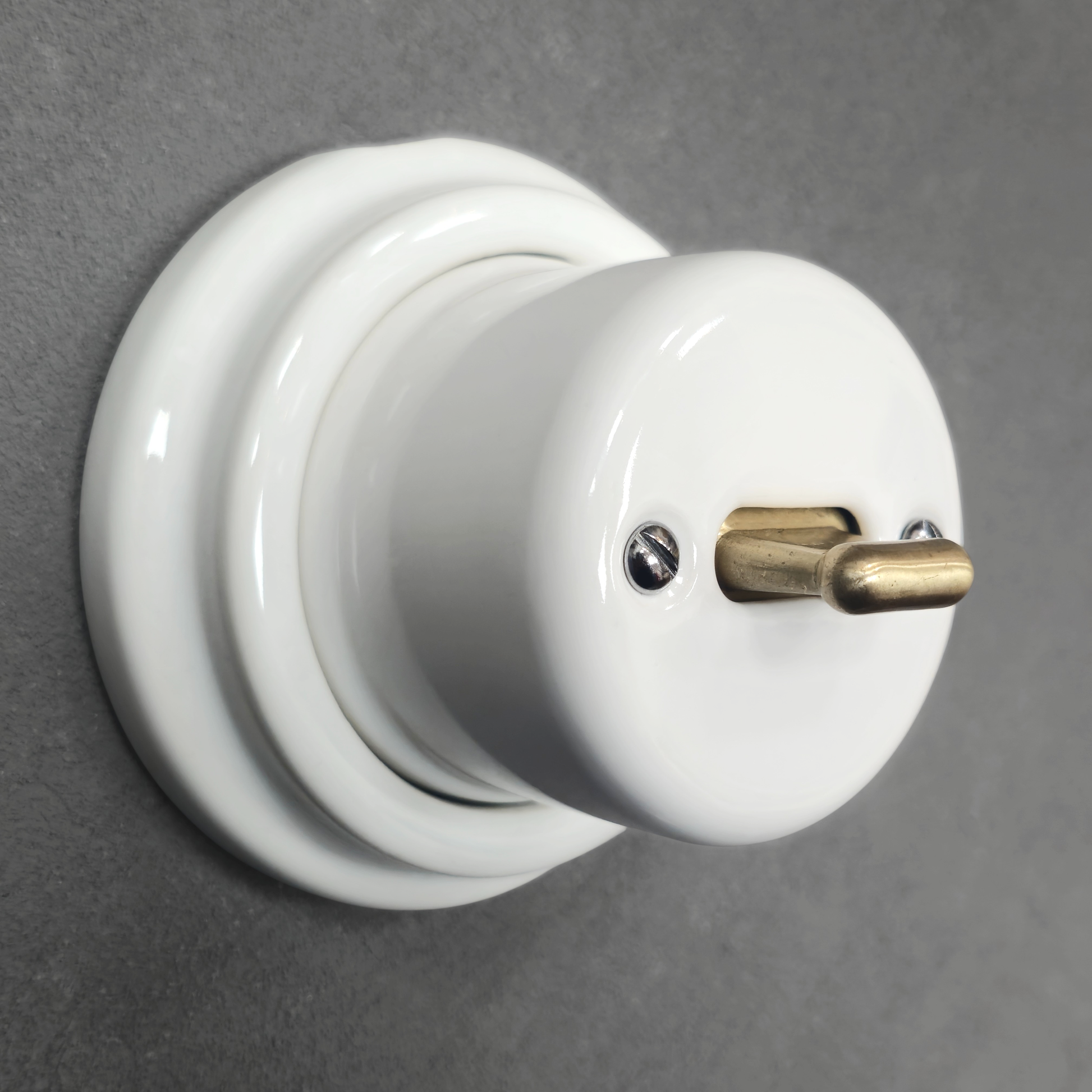 white porcelain intermediate toggle switch, surface-mount, angled