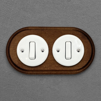 double white porcelain 1gang2way light switch dark wood frame, flush-mount, front