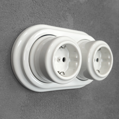 Double SCHUKO porcelain socket, white, surface-mounted, side view