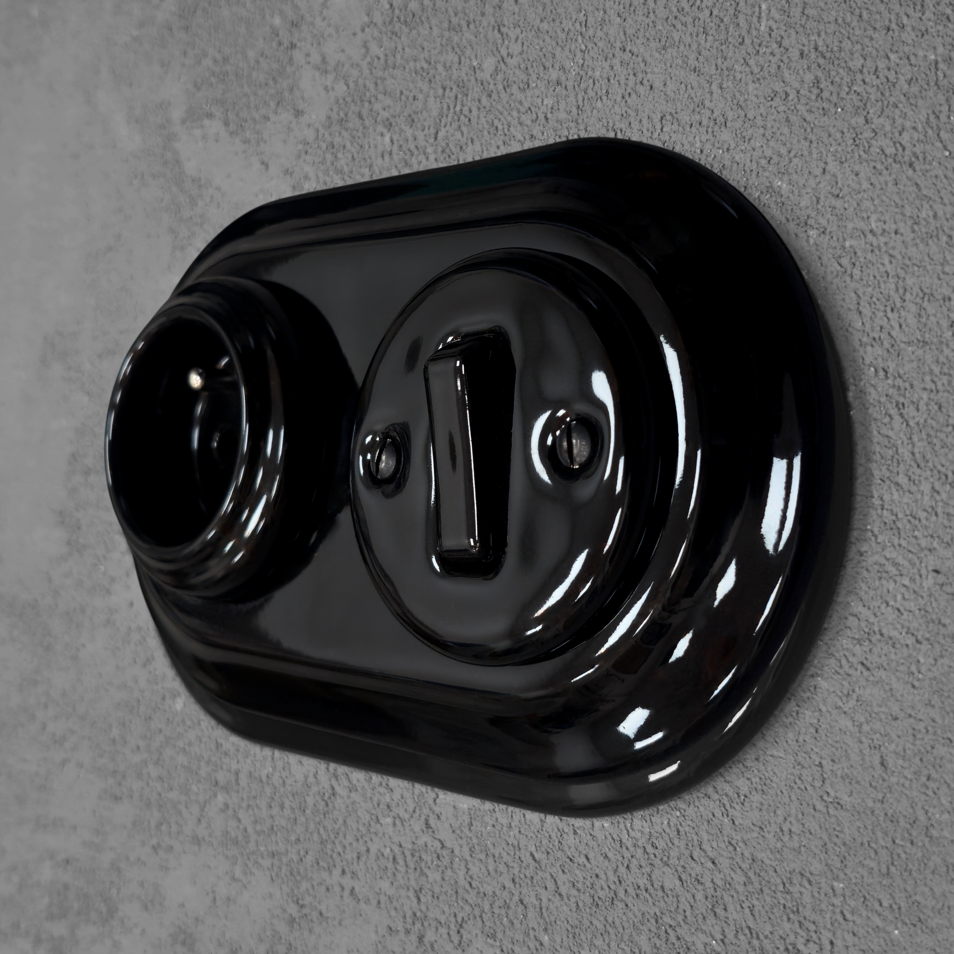 Black porcelain Type F socket with light switch, flush-mount, angle