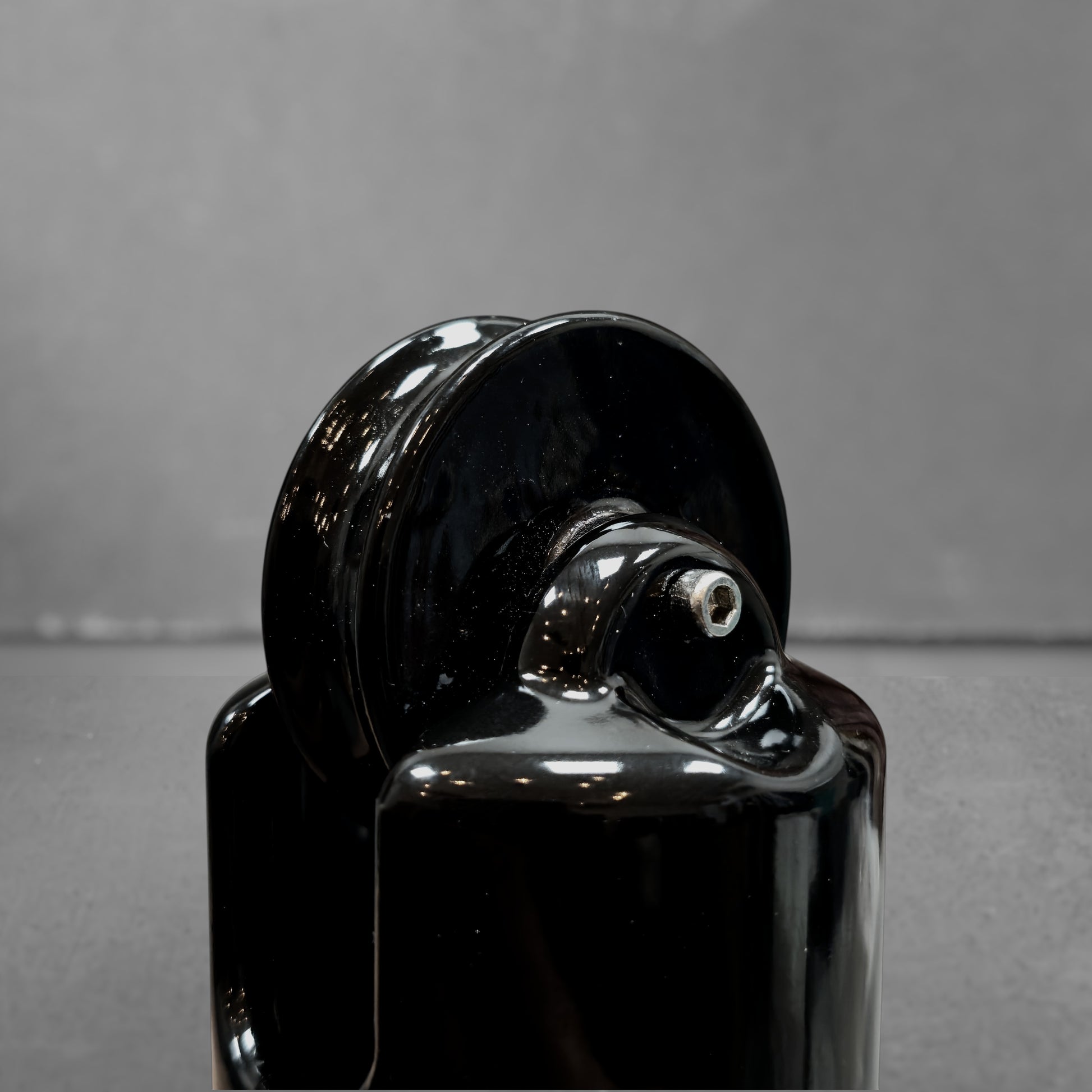 black porcelain counterweight for light fixture, close-up