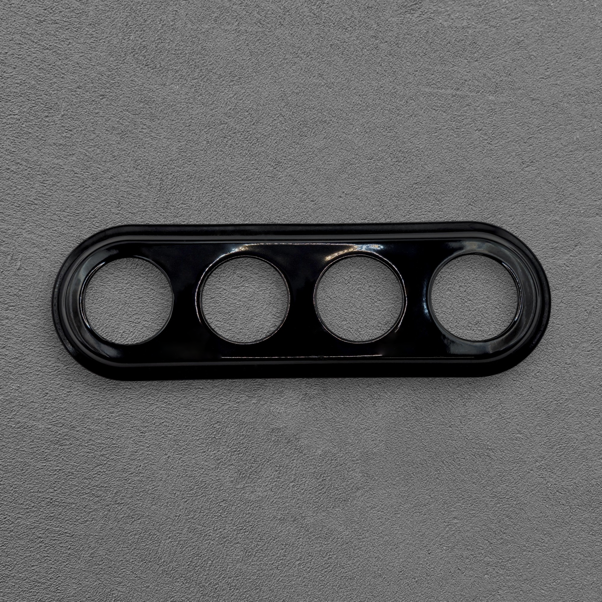 black porcelain quadruple frame, flush-mount, front