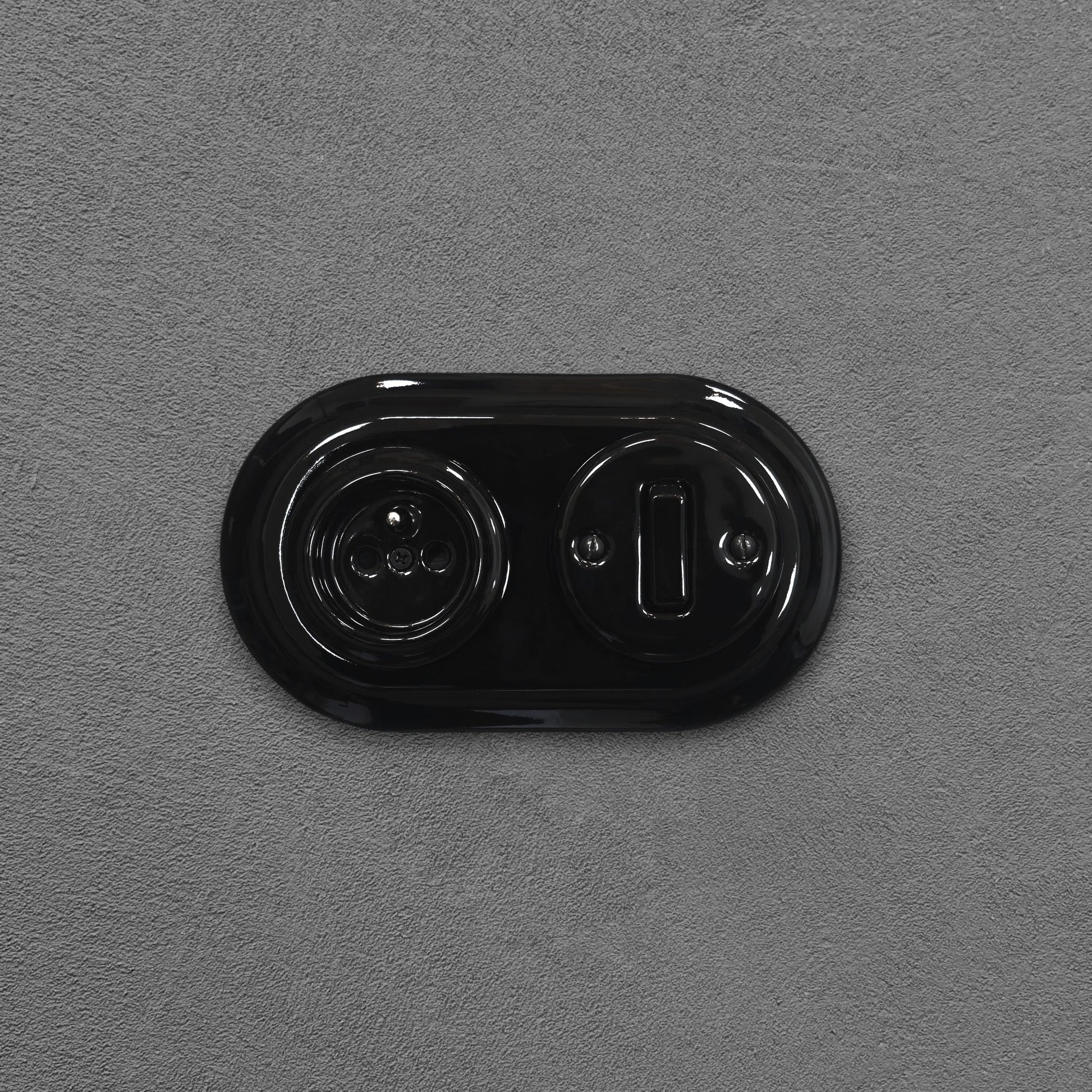 Black porcelain Type F socket with light switch, flush-mount