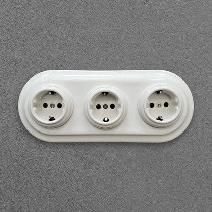 Triple SCHUKO porcelain socket, white, flush-mounted, front view