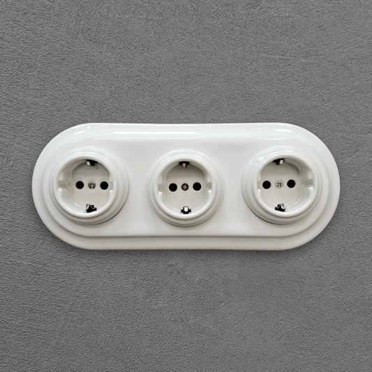 Triple SCHUKO porcelain socket, white, flush-mounted, front view
