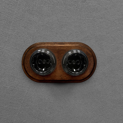 Double SCHUKO porcelain socket with dark wooden frame, black, flush-mounted