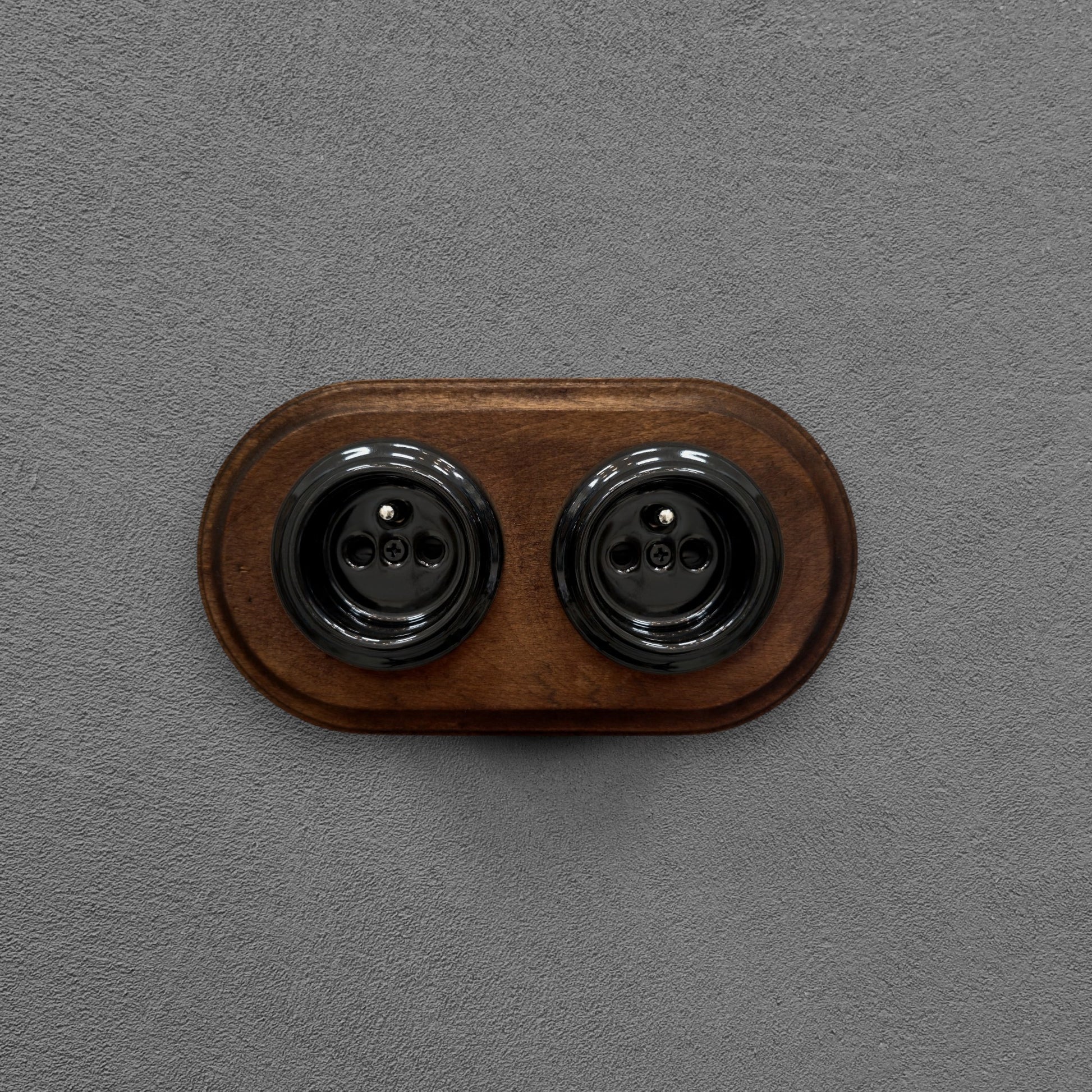Double black French porcelain socket with dark wood frame, flush-mount