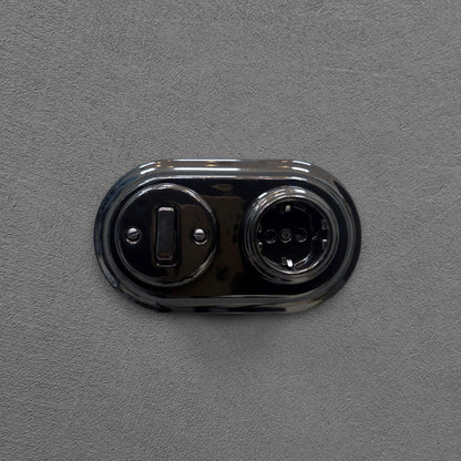 Single SCHUKO porcelain socket with light switch, black, flush-mounted