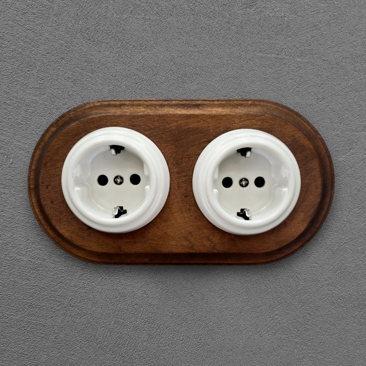 Double SCHUKO porcelain socket with dark wooden frame, white, flush-mounted, front view